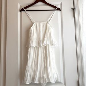 Mini white romper by EXLURA. Purchased off of Amazon. NEVER WORN - tags included